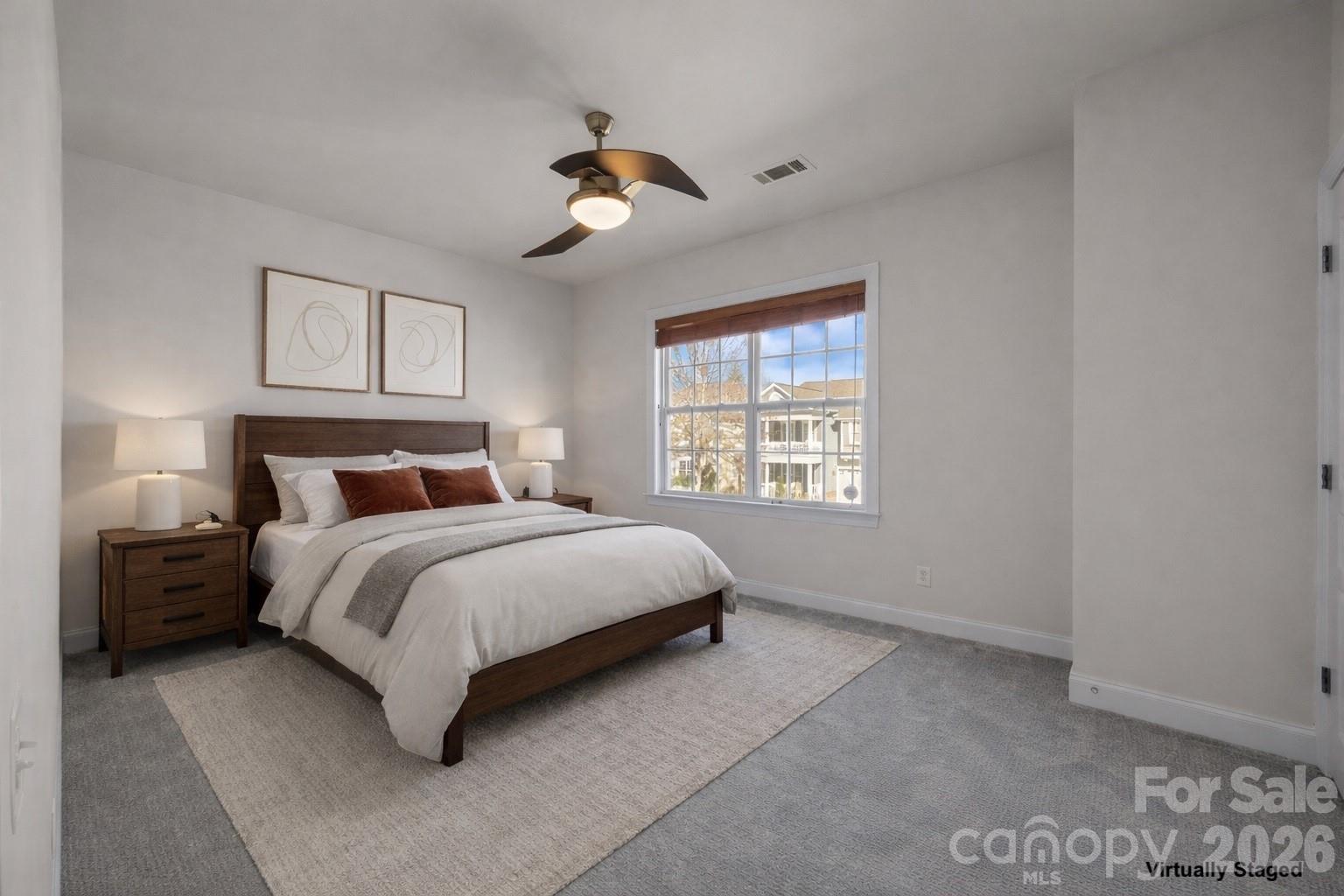 9429 Ridgeforest Drive Charlotte, NC 28277 - Photo 28 of 35 a bedroom with a bed and a window