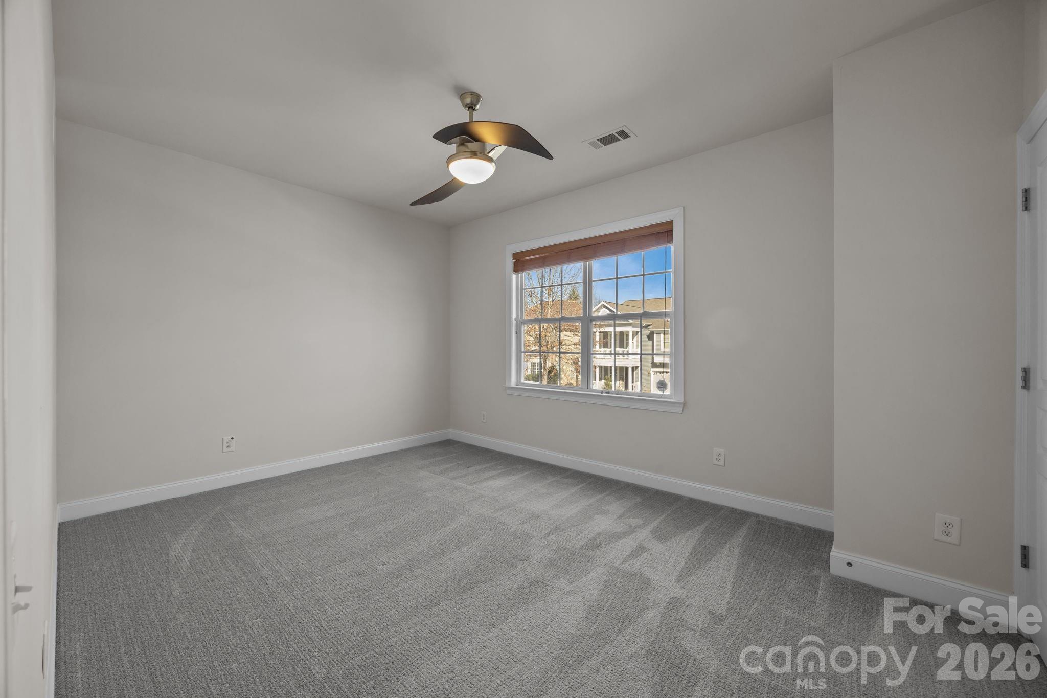 9429 Ridgeforest Drive Charlotte, NC 28277 - Photo 29 of 35 an empty room with a window