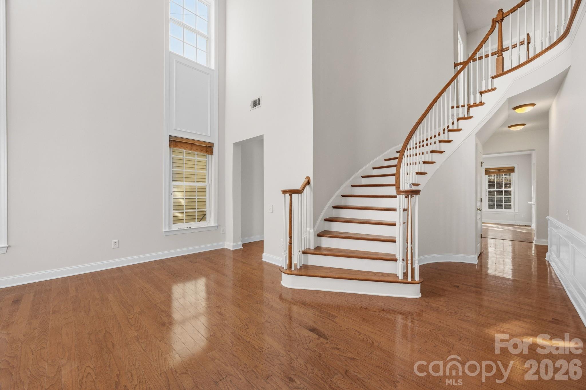 9429 Ridgeforest Drive Charlotte, NC 28277 - Photo 5 of 35 a view of entryway and hall with wooden floor