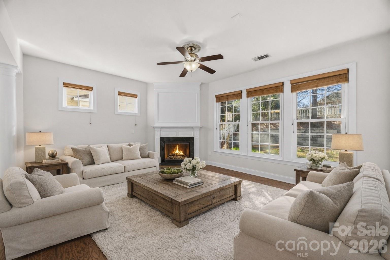 9429 Ridgeforest Drive Charlotte, NC 28277 - Photo 10 of 35 a living room with furniture fireplace and a large window