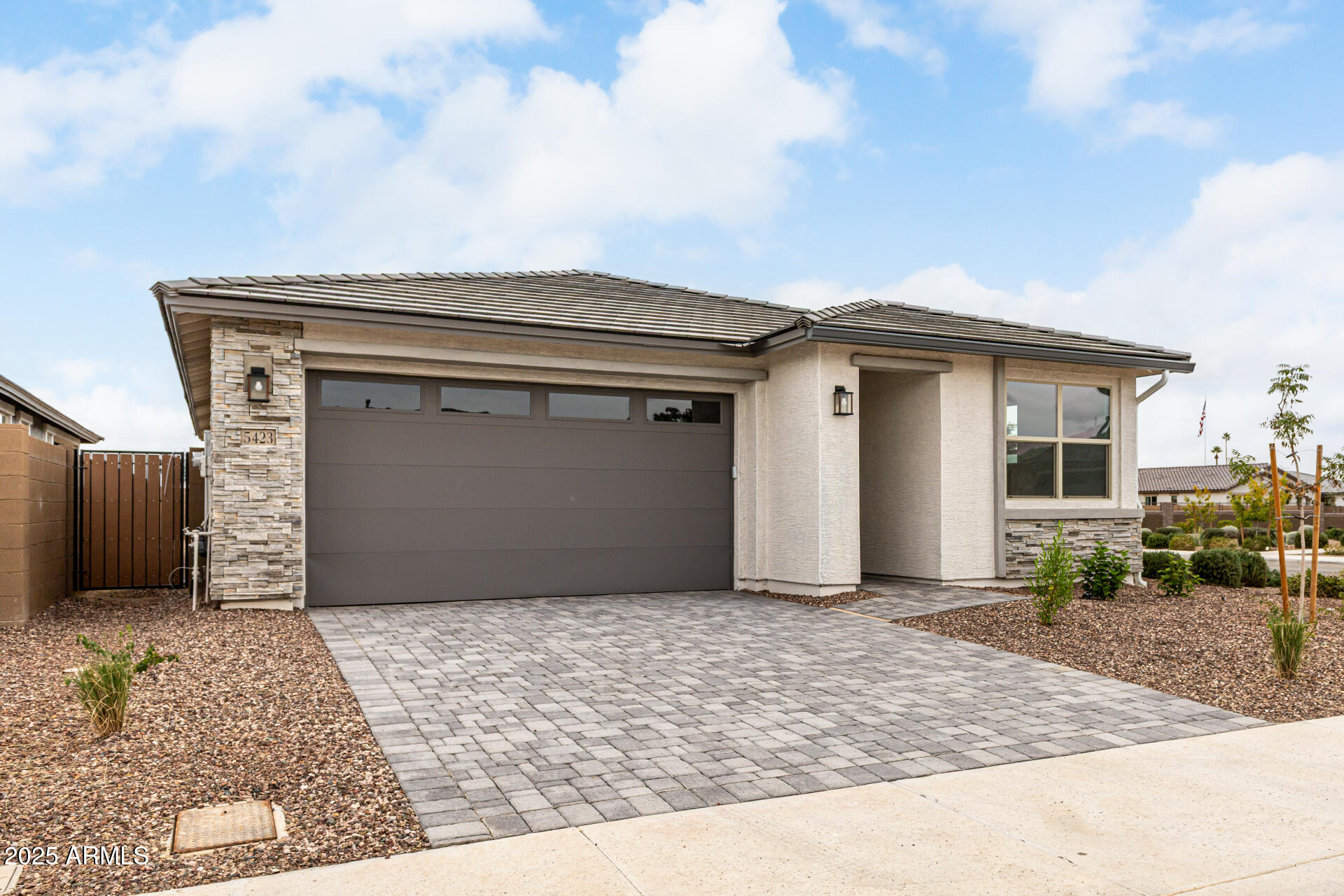 5423 West Royal Palm Road Glendale, AZ 85302 - Photo 27 of 32 a front view of a house with a yard