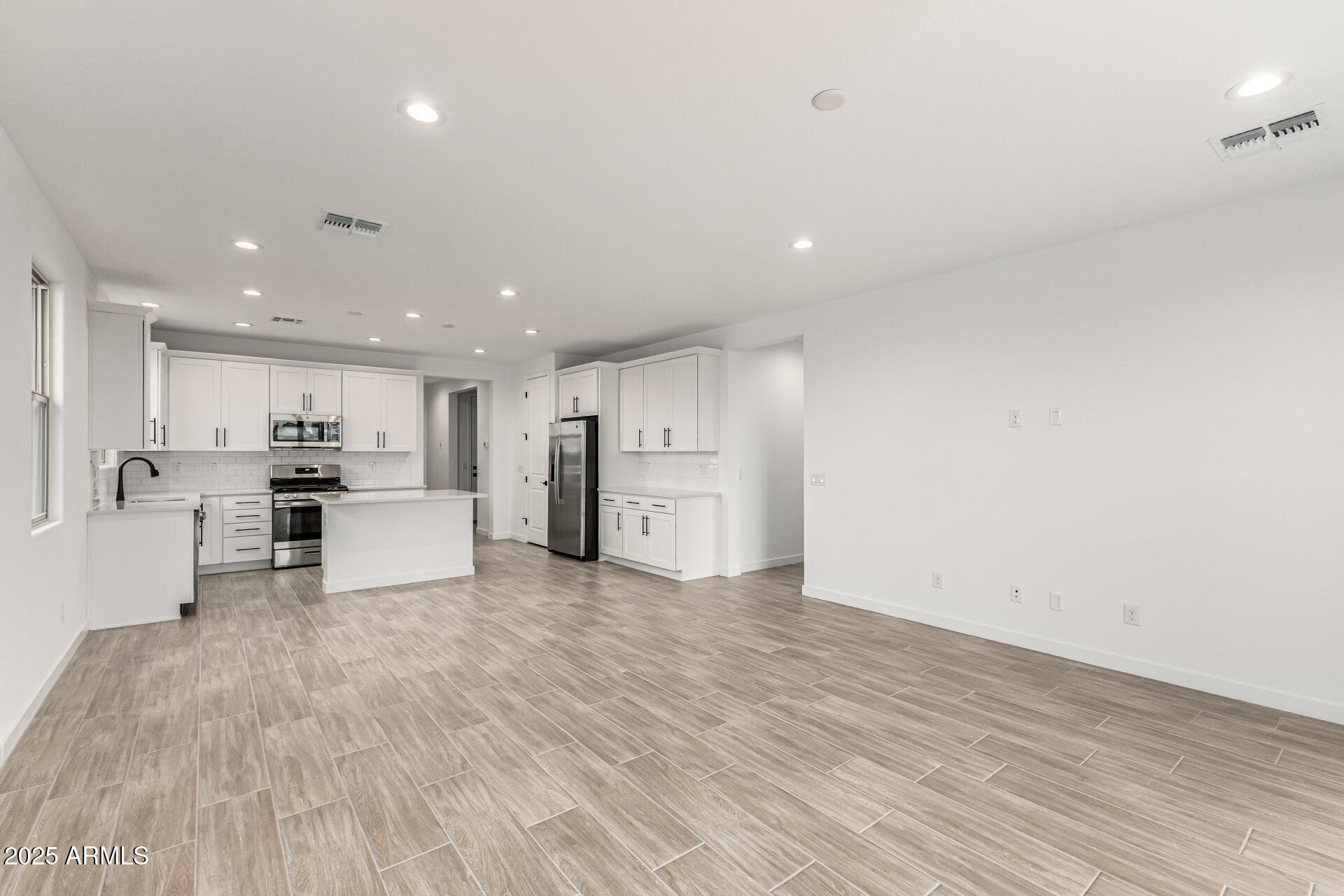 5423 West Royal Palm Road Glendale, AZ 85302 - Photo 8 of 32 a view of kitchen with kitchen island and stainless steel appliances
