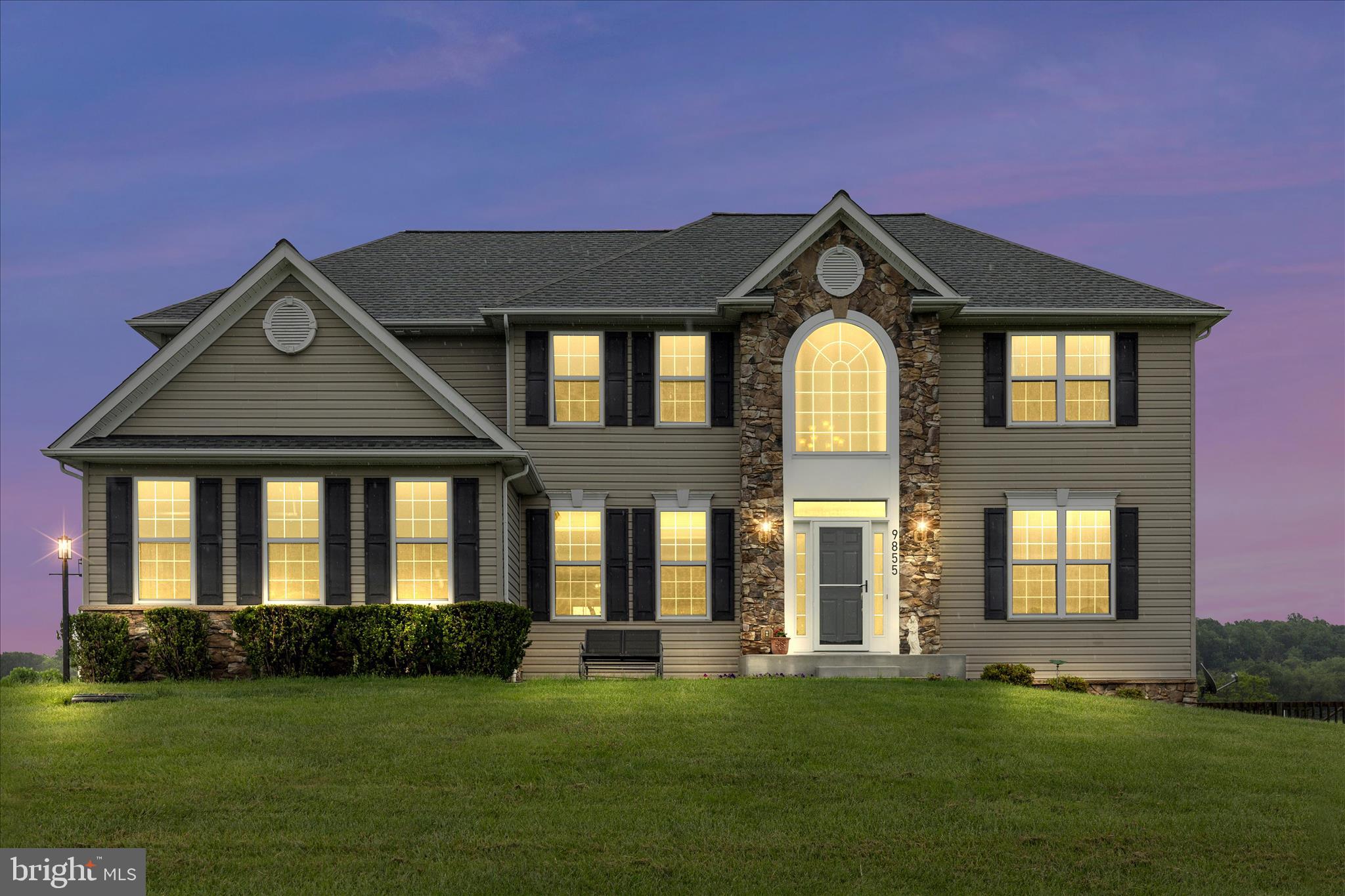 9855 McKinstry Mill Road New Windsor, MD 21776 - Photo 4 of 76 a front view of a house with a yard