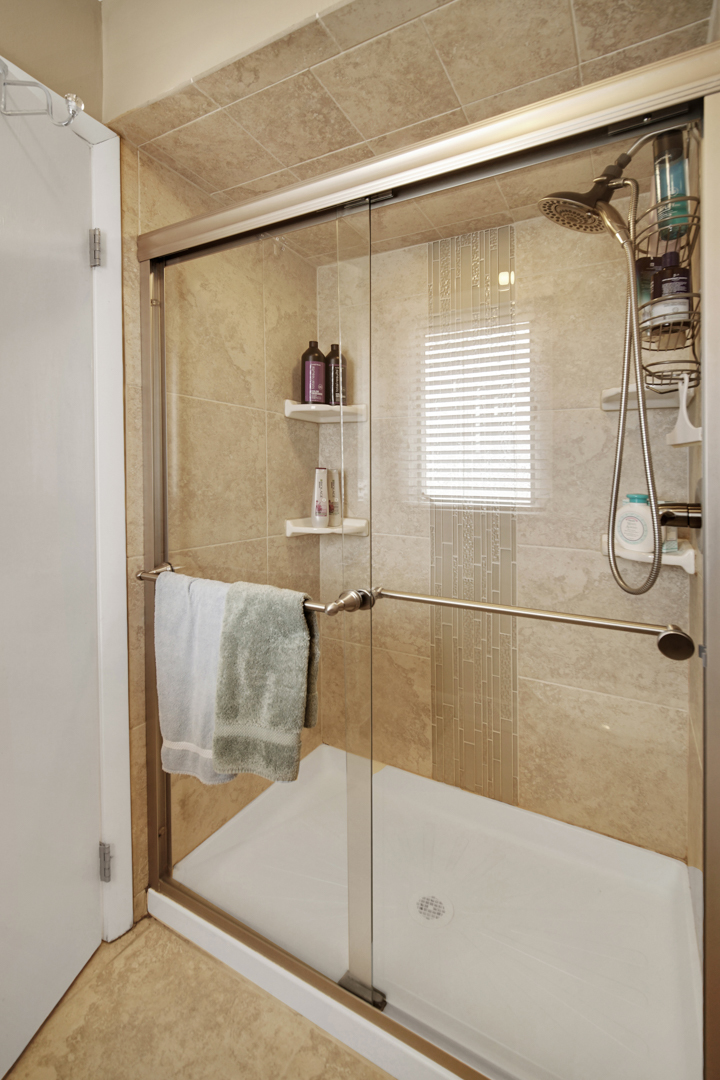 1102 Compton Point Addison, IL 60101 - Photo 16 of 34 a bathroom with a shower and a bath tub