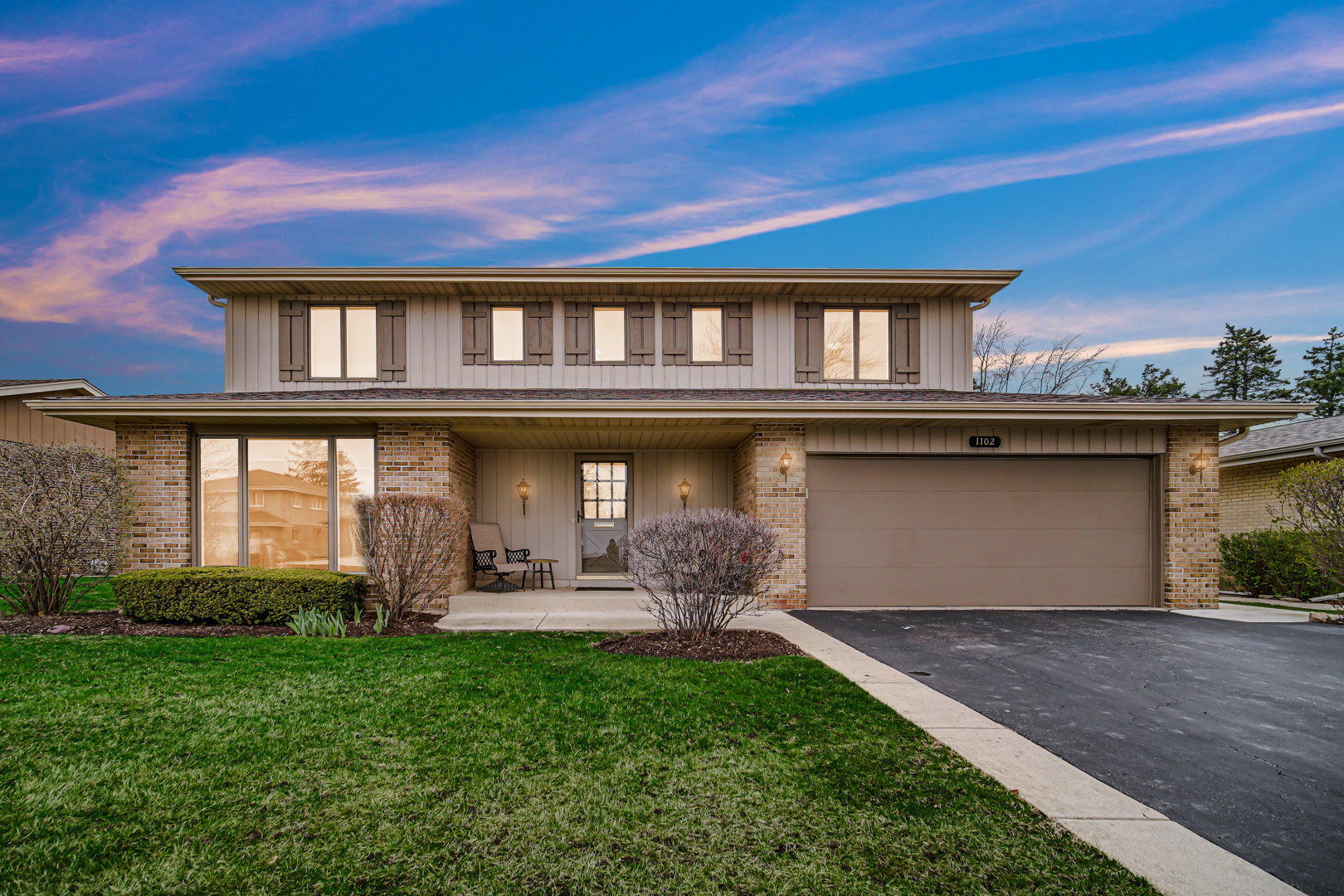 1102 Compton Point Addison, IL 60101 - Photo 2 of 34 a front view of a house with a yard