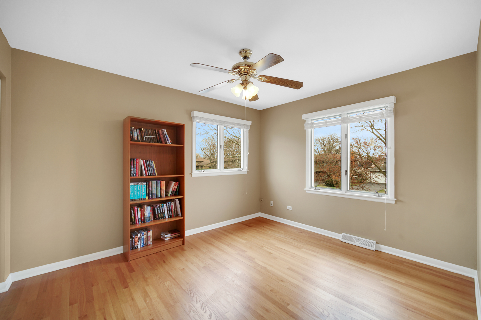 1102 Compton Point Addison, IL 60101 - Photo 21 of 34 a view of wooden floor in an empty room with a window