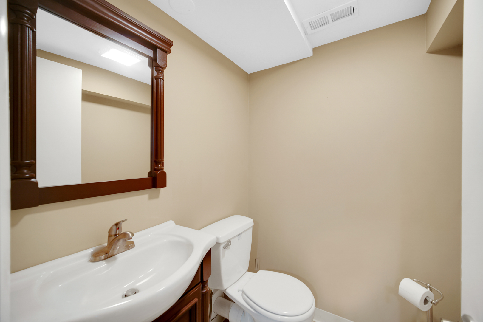 1102 Compton Point Addison, IL 60101 - Photo 25 of 34 a bathroom with a sink a toilet and mirror