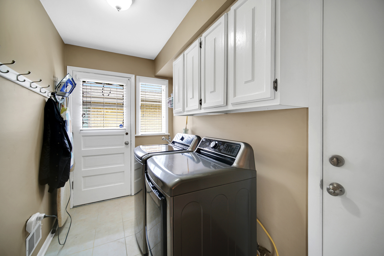 1102 Compton Point Addison, IL 60101 - Photo 10 of 34 a kitchen with a sink cabinets and a window
