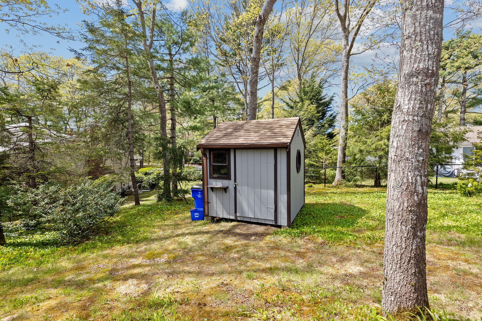 10 Quamhassett Road Buzzards Bay, MA 02532 - Photo 23 of 30 a view of a backyard with a tree