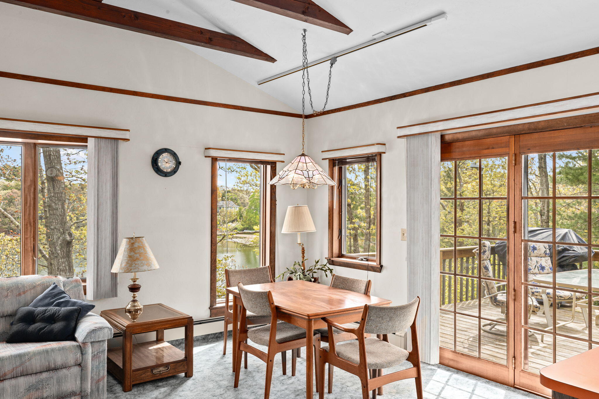 10 Quamhassett Road Buzzards Bay, MA 02532 - Photo 10 of 30 a view of a dining room with furniture large windows and wooden floor