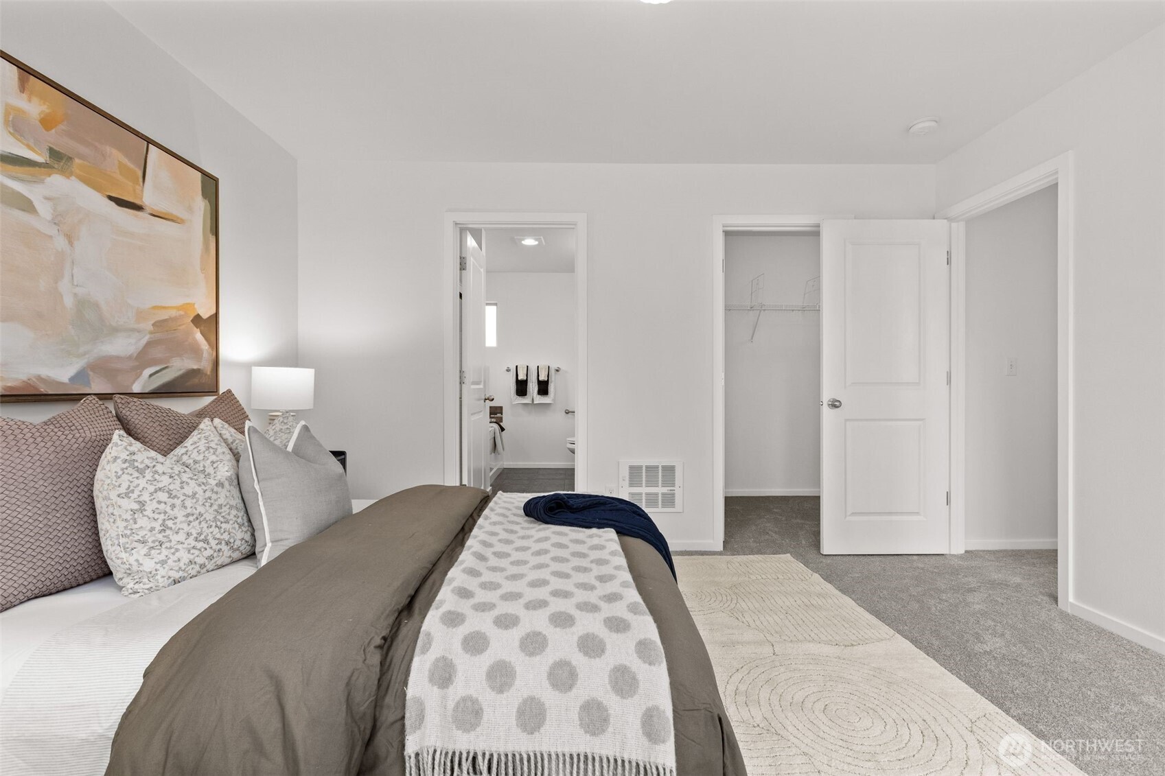 16516 2nd Park Southeast Bothell, WA 98012 - Photo 22 of 39 a bedroom with a large bed and a chandelier