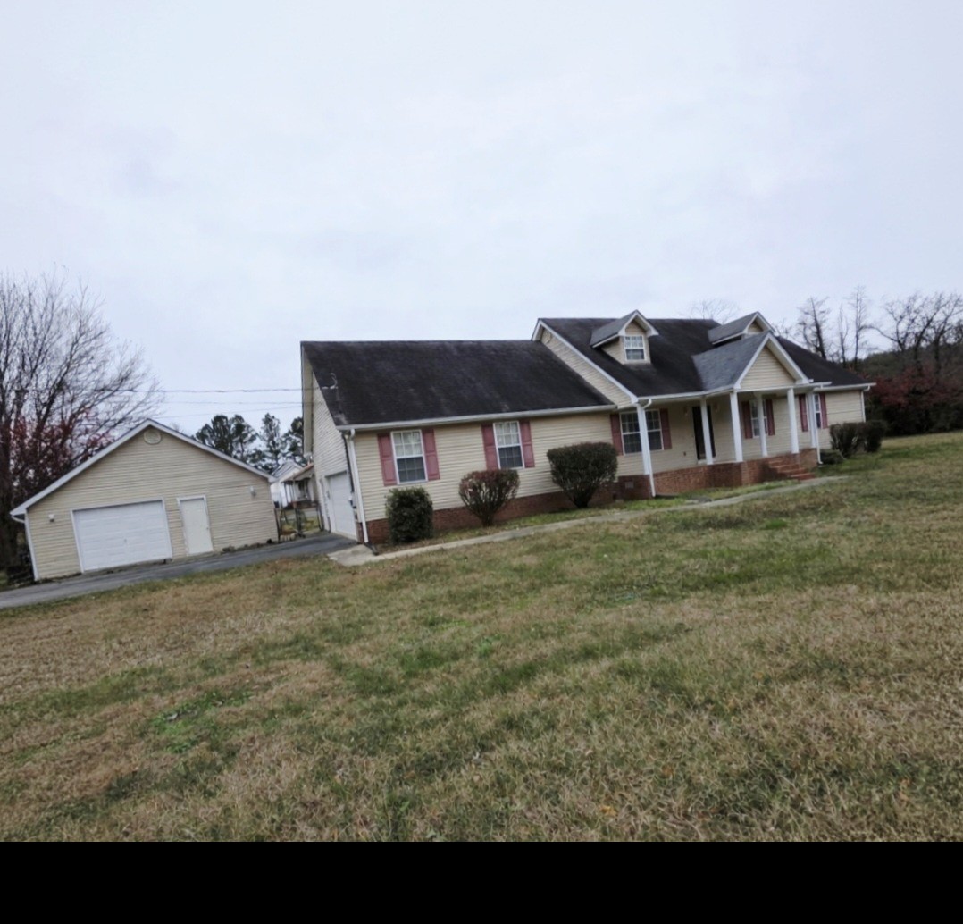 102 Cascade Lane Bell Buckle, TN 37020 - Photo 1 of 21 a front view of a house with a yard