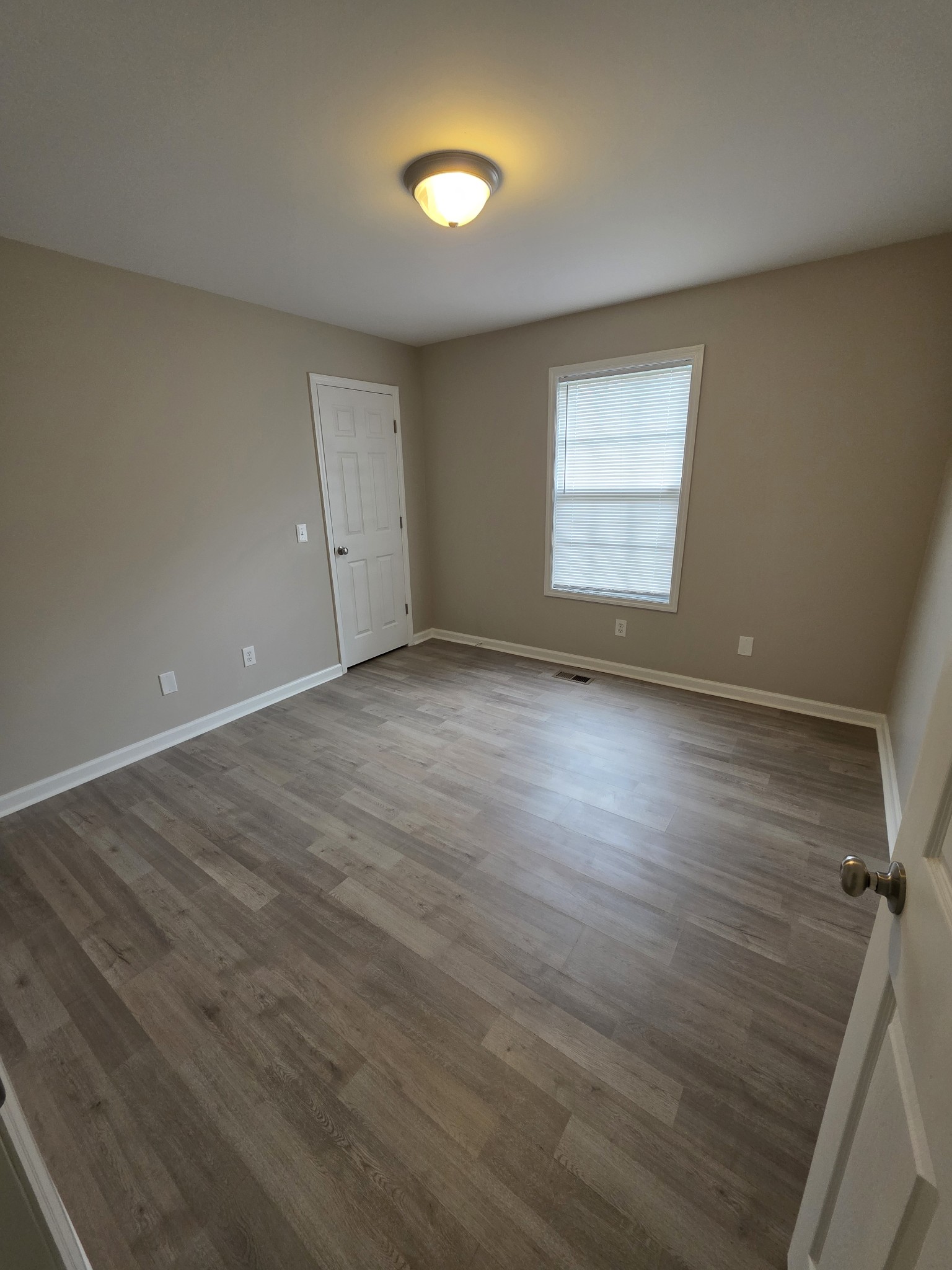 102 Cascade Lane Bell Buckle, TN 37020 - Photo 15 of 21 an empty room with wooden floor and windows