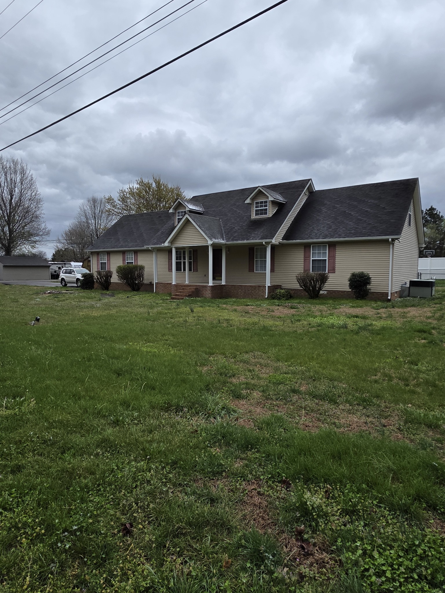 102 Cascade Lane Bell Buckle, TN 37020 - Photo 3 of 21 a view of a big house with a big yard and potted plants