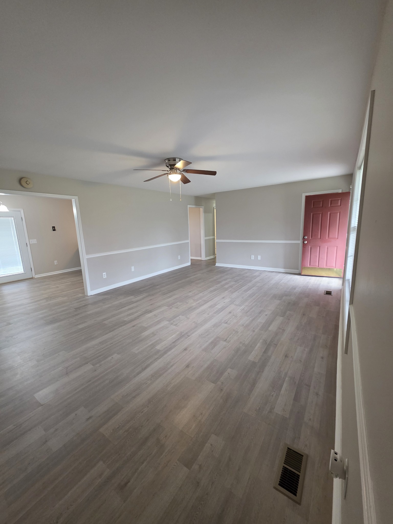 102 Cascade Lane Bell Buckle, TN 37020 - Photo 4 of 21 an empty room with wooden floor and windows