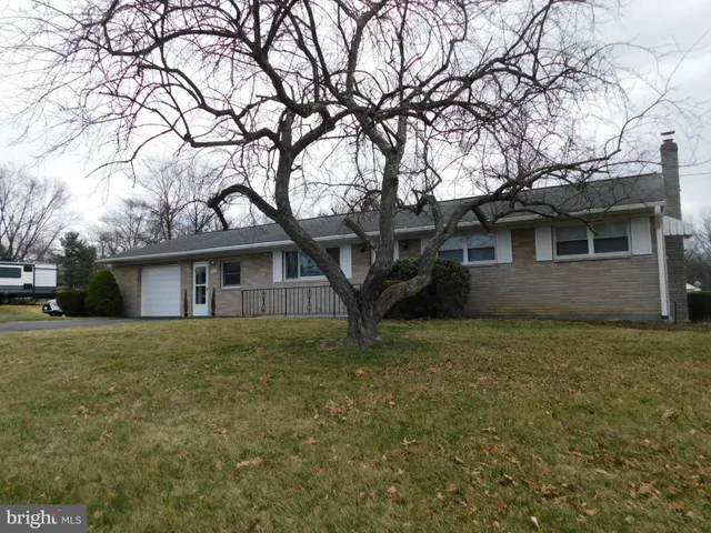 a house with trees in front of it
