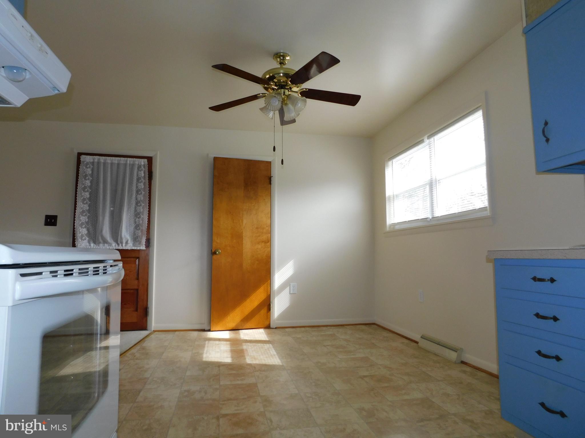 1569 Frank Road Chambersburg, PA 17202 - Photo 7 of 18 a view of a livingroom with a fireplace and window