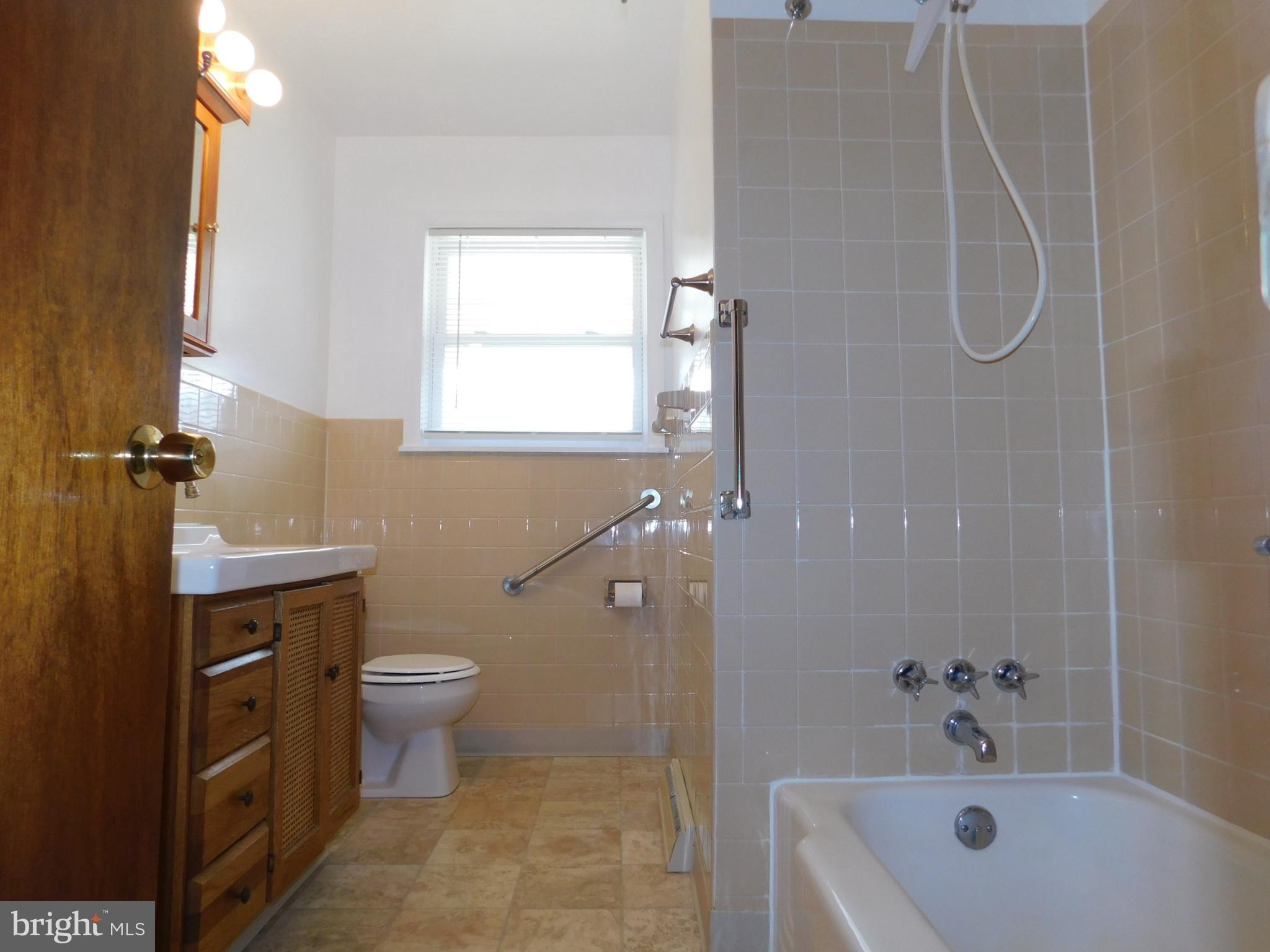 1569 Frank Road Chambersburg, PA 17202 - Photo 10 of 18 a bathroom with a sink a toilet and shower
