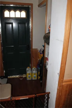 a bedroom with a bed and a mirror