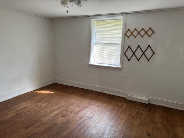 1150 Pocahontas Road Pocahontas, TN 38061 - Photo 19 of 33 wooden floor in an empty room with a window