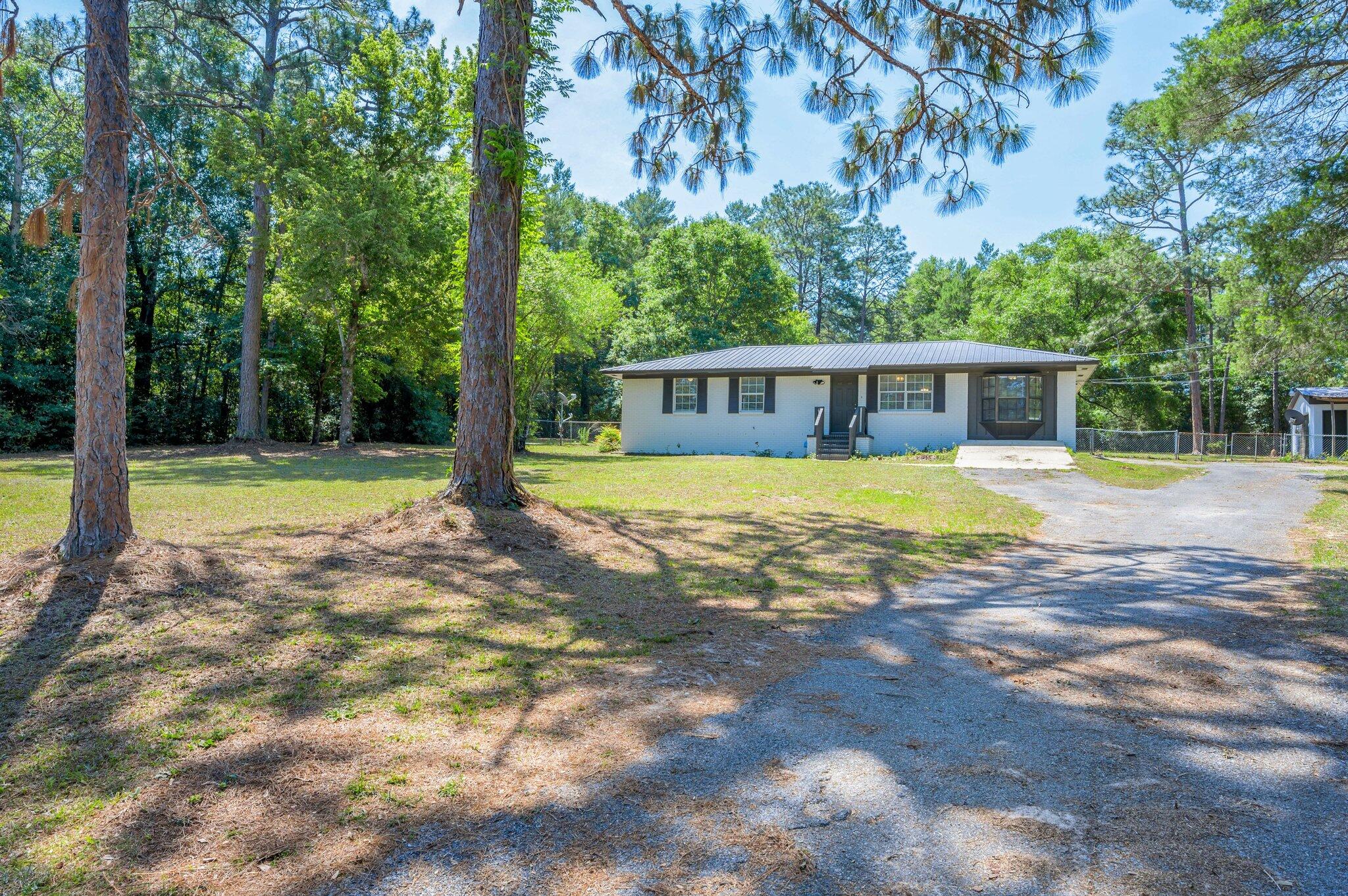3970 Indian Mound Road Crestview, FL 32539 - Photo 1 of 33 a view of a swimming pool with a patio and a yard