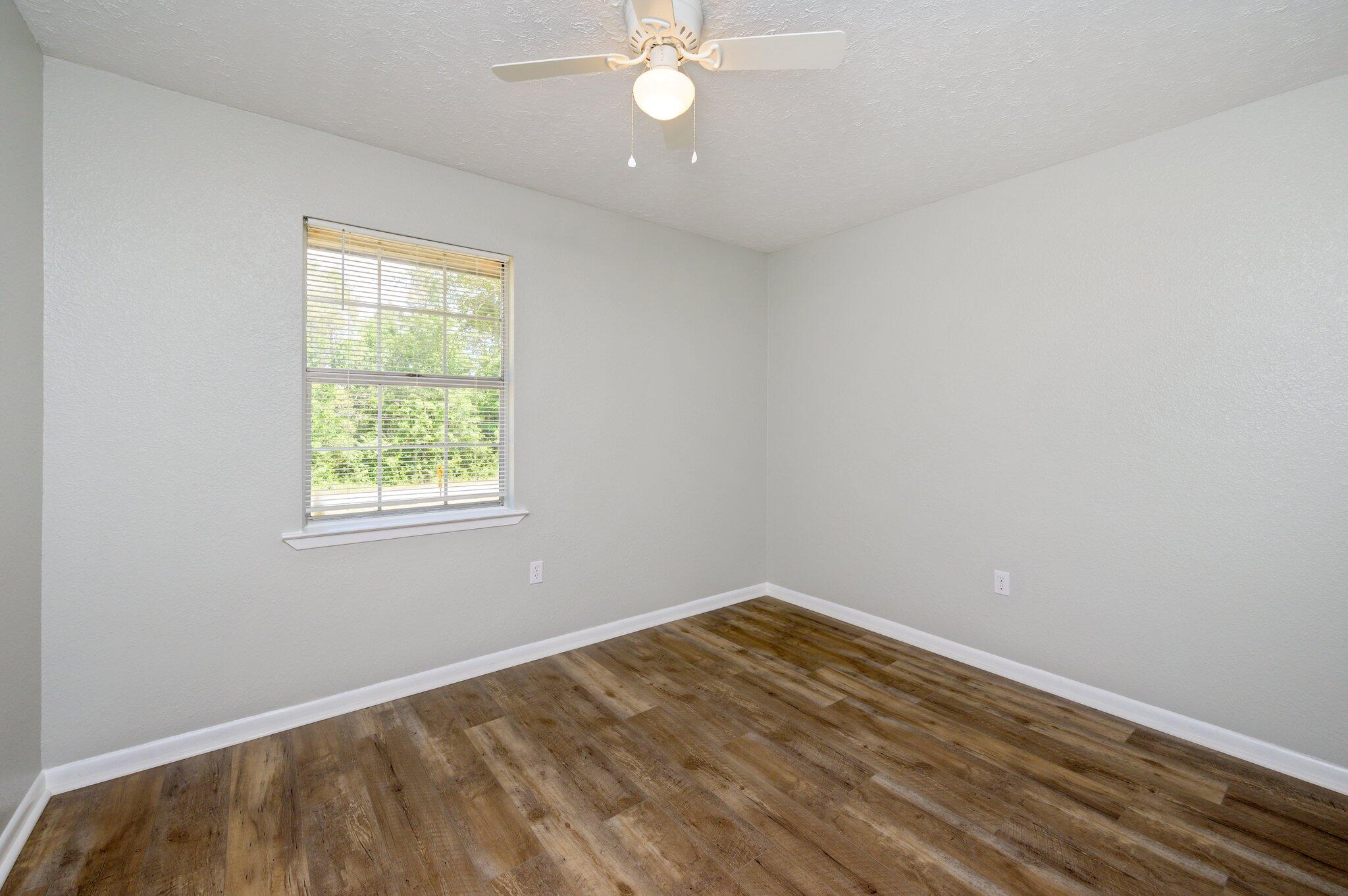 3970 Indian Mound Road Crestview, FL 32539 - Photo 17 of 33 an empty room with a fan & a window
