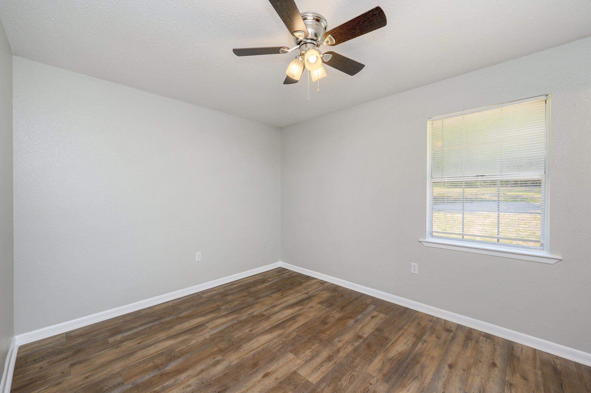 3970 Indian Mound Road Crestview, FL 32539 - Photo 19 of 33 an empty room with a window and a fan