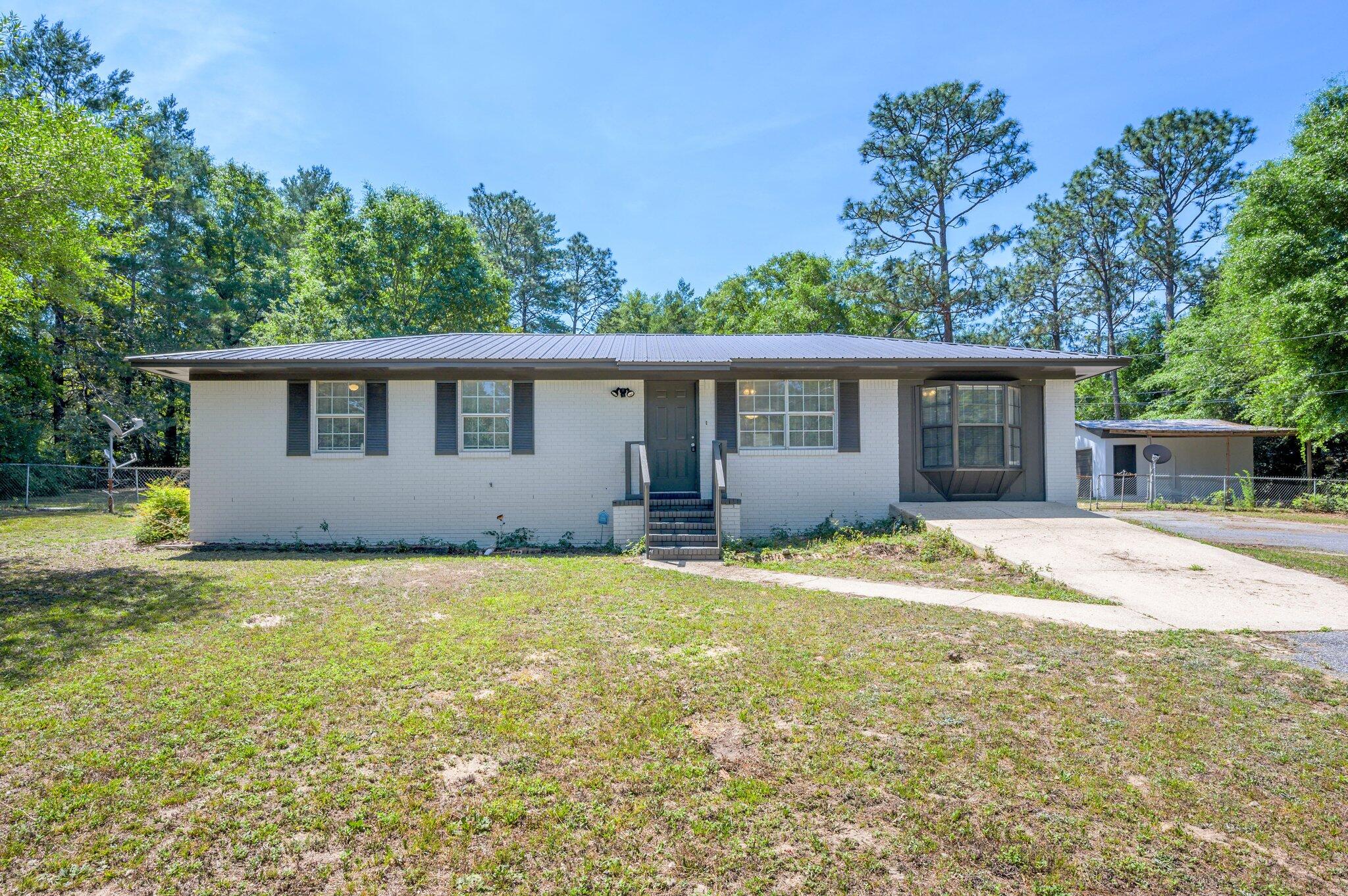 3970 Indian Mound Road Crestview, FL 32539 - Photo 3 of 33 a view of a house with a yard and potted plants