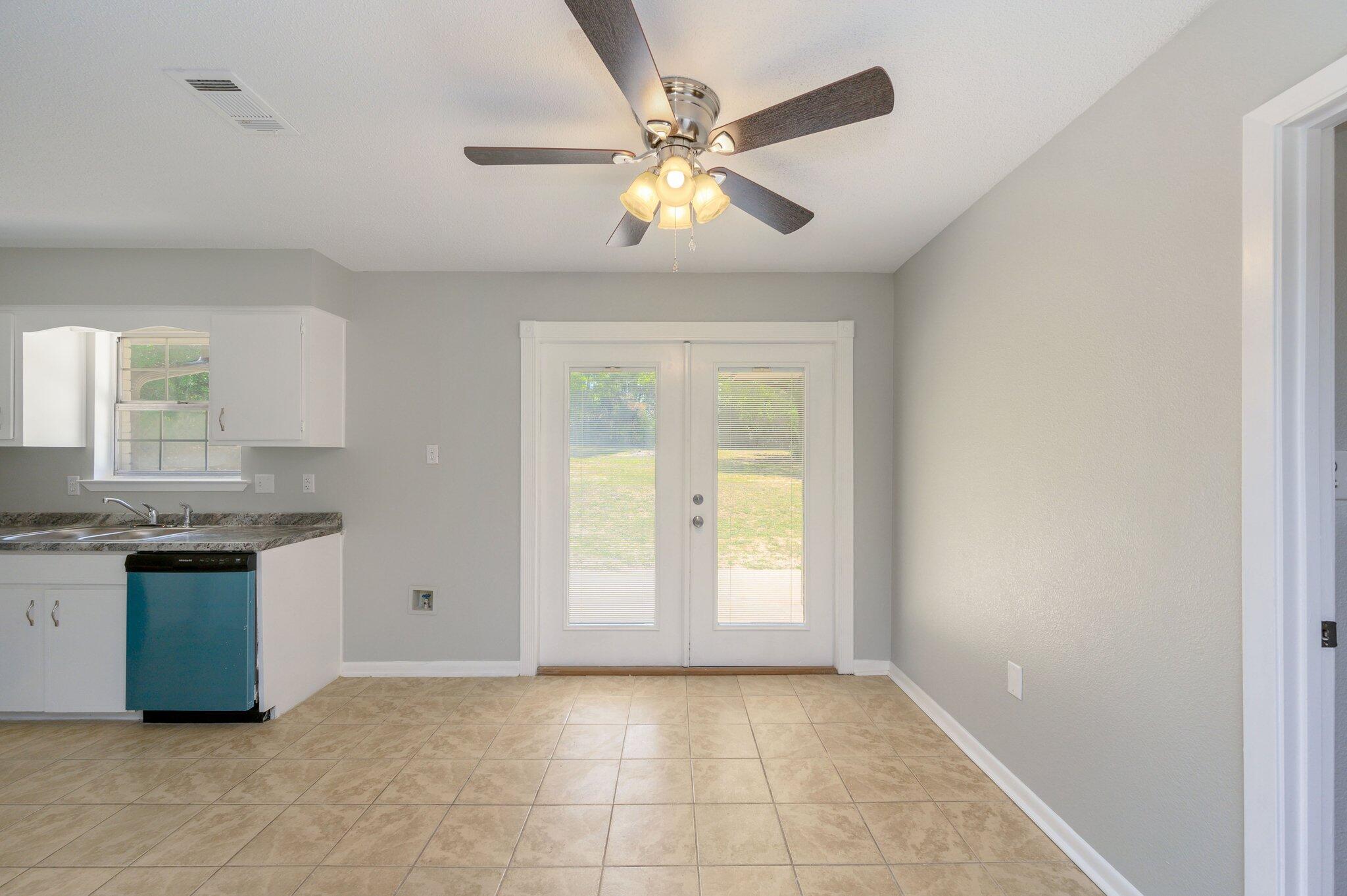 3970 Indian Mound Road Crestview, FL 32539 - Photo 7 of 33 wooden floor in an empty room with a window