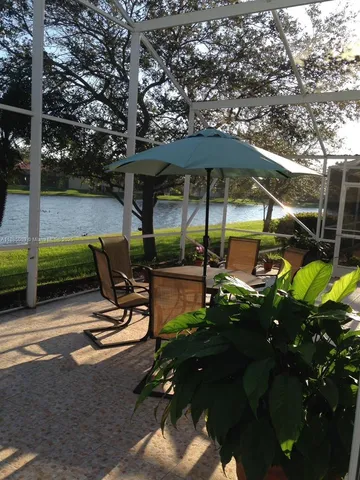 a view of backyard with sitting area