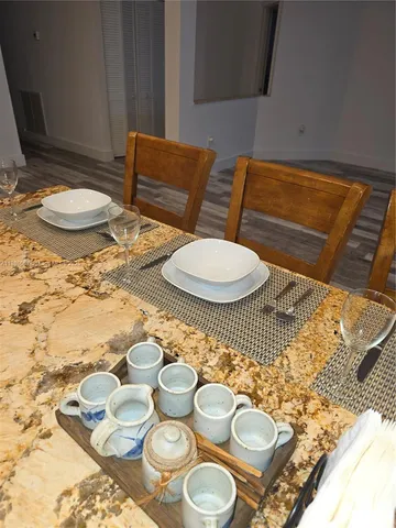 a living room with furniture and a rug