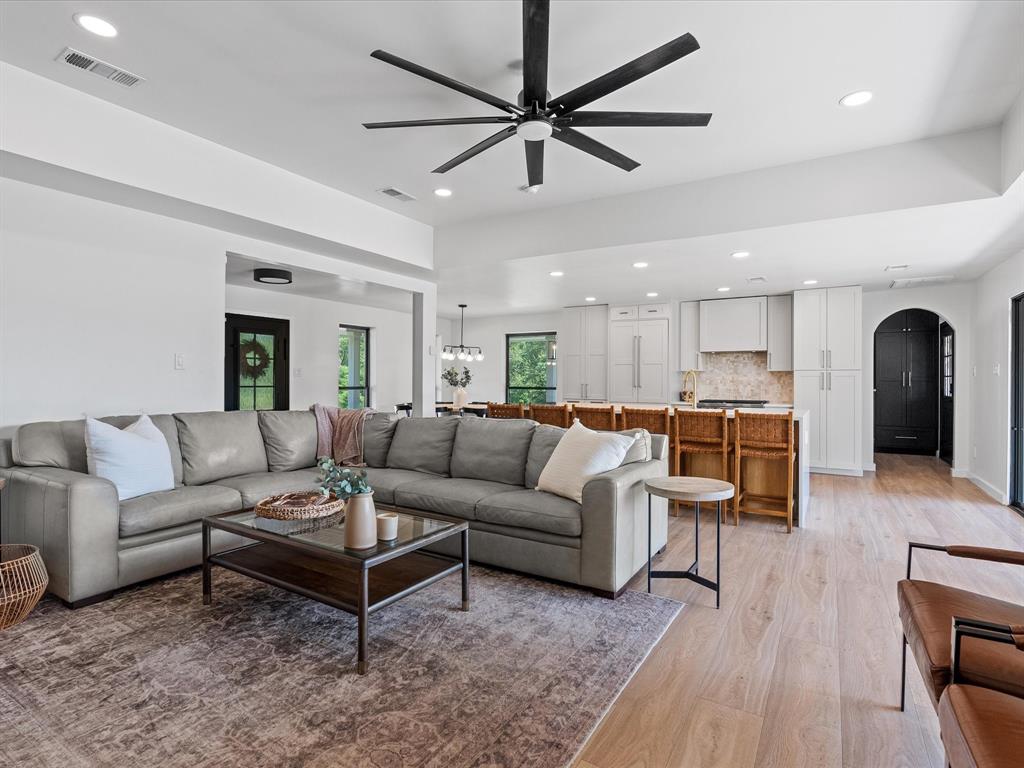 946 Burke Road Gunter, TX 75058 - Photo 6 of 38 Living room with detailed architecture walkways, light wood flooring, recessed lighting, ceiling fan, and a chandelier