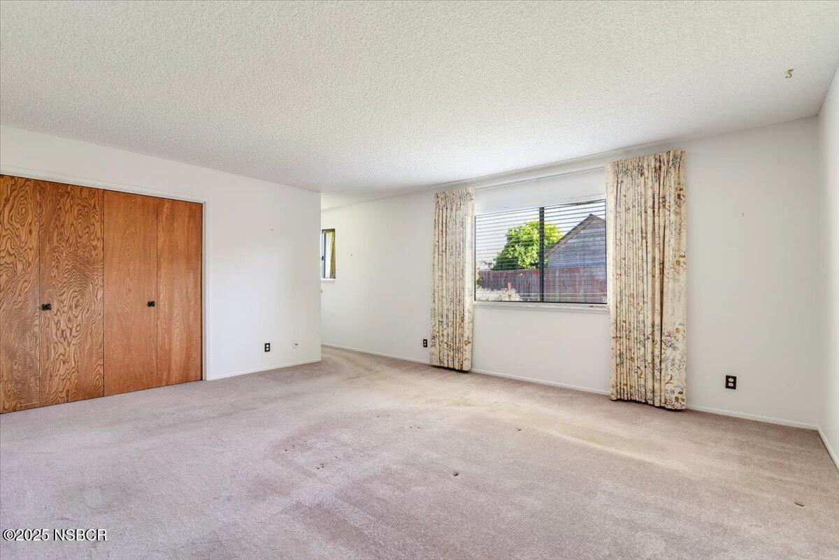244 Pegasus Avenue Lompoc, CA 93436 - Photo 16 of 28 a view of an empty room with a window