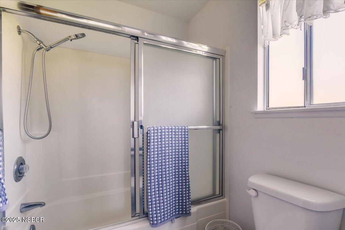 244 Pegasus Avenue Lompoc, CA 93436 - Photo 18 of 28 a bathroom with a shower and a toilet