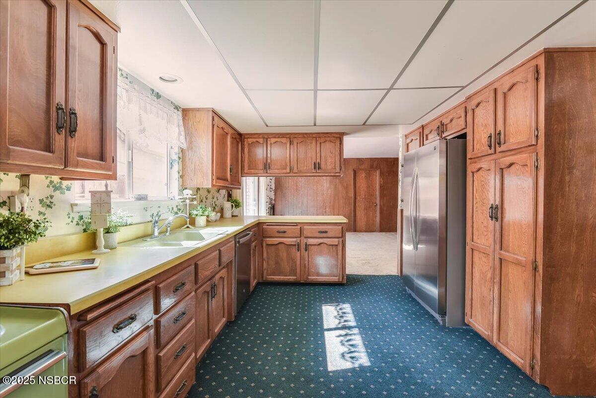 244 Pegasus Avenue Lompoc, CA 93436 - Photo 8 of 28 a kitchen with sink cabinets and window