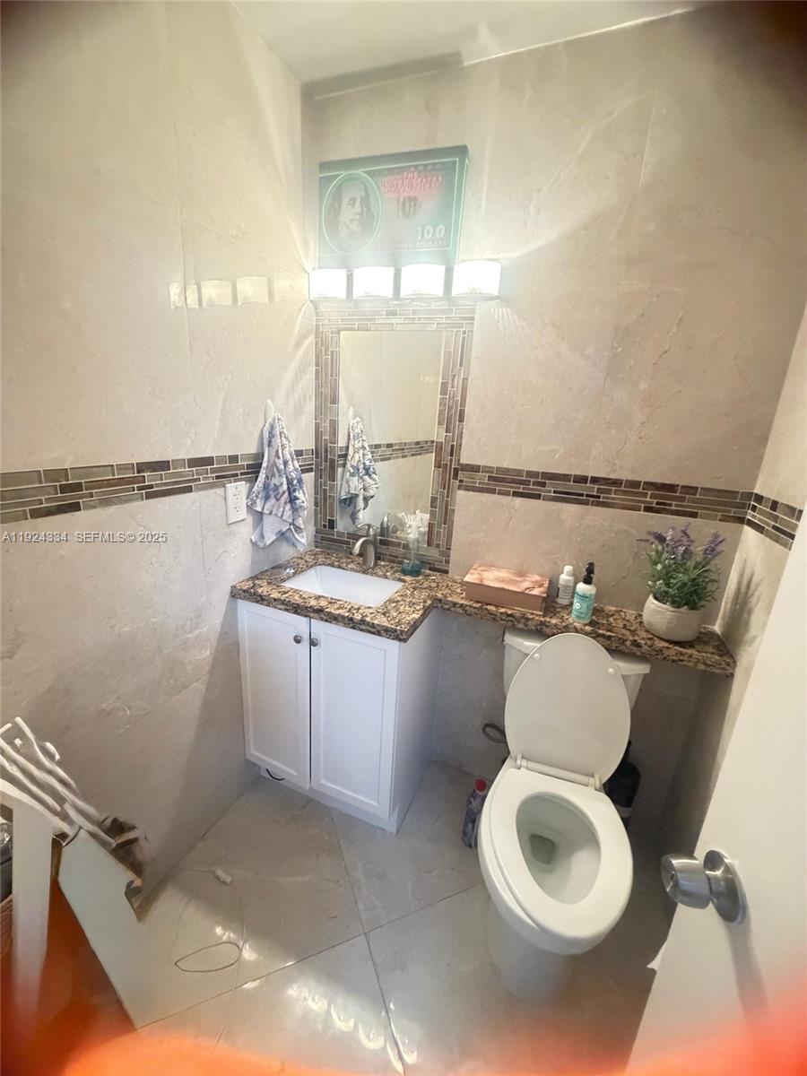 3001 Northwest 4th Terrace, Unit 158 Pompano Beach, FL 33064 - Photo 14 of 23 a bathroom with a sink and mirror