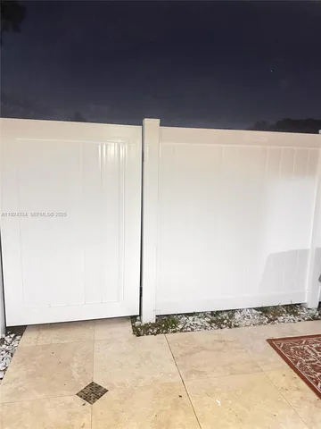 a view of a refrigerator with wooden floor