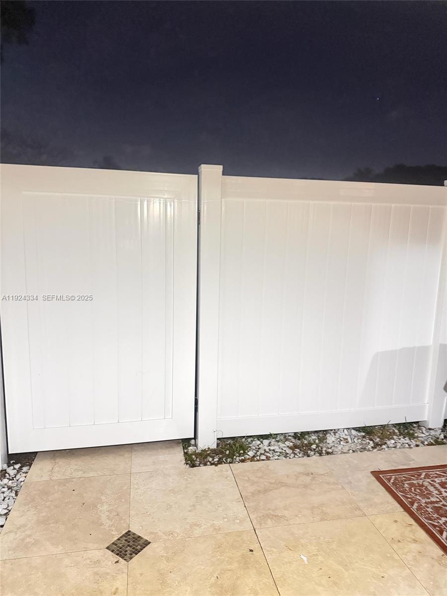 3001 Northwest 4th Terrace, Unit 158 Pompano Beach, FL 33064 - Photo 20 of 23 a view of a refrigerator with wooden floor