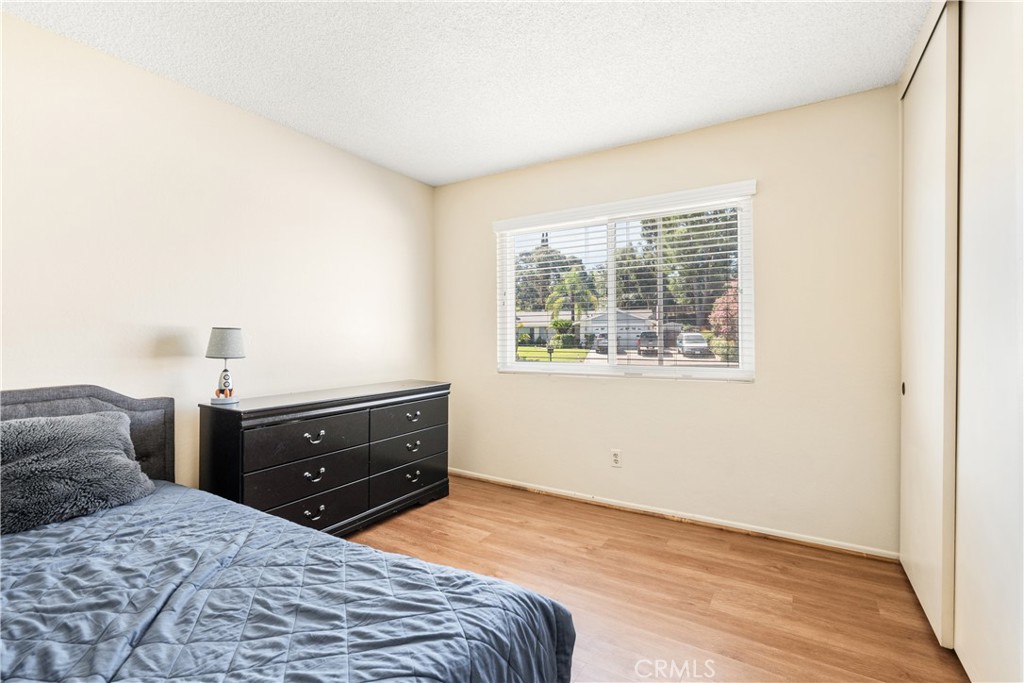 2111 Whitestone Drive Riverside, CA 92506 - Photo 11 of 17 a bedroom with a bed and window