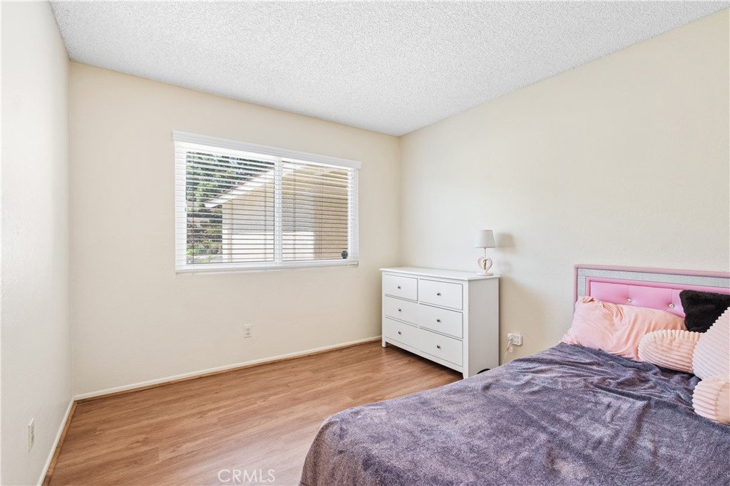 2111 Whitestone Drive Riverside, CA 92506 - Photo 12 of 17 a bedroom with a bed and a window