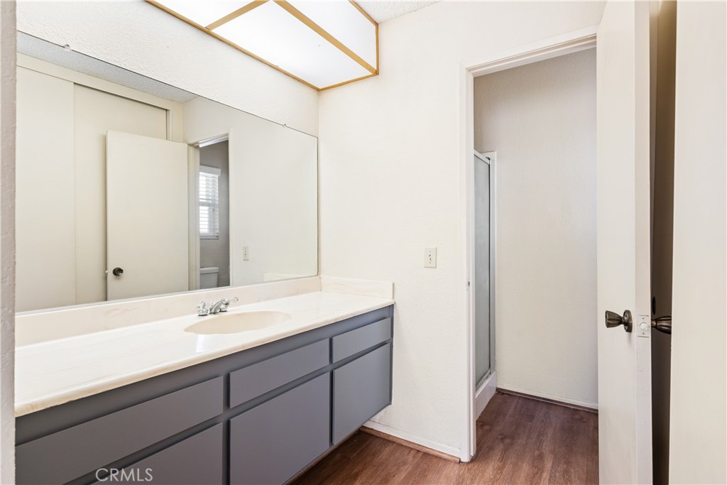 2111 Whitestone Drive Riverside, CA 92506 - Photo 14 of 17 a bathroom with a double vanity sink and mirror