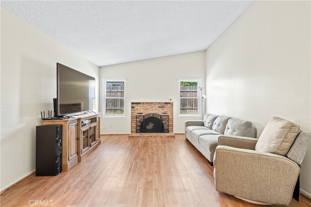 2111 Whitestone Drive Riverside, CA 92506 - Photo 3 of 17 a living room with furniture and a fireplace