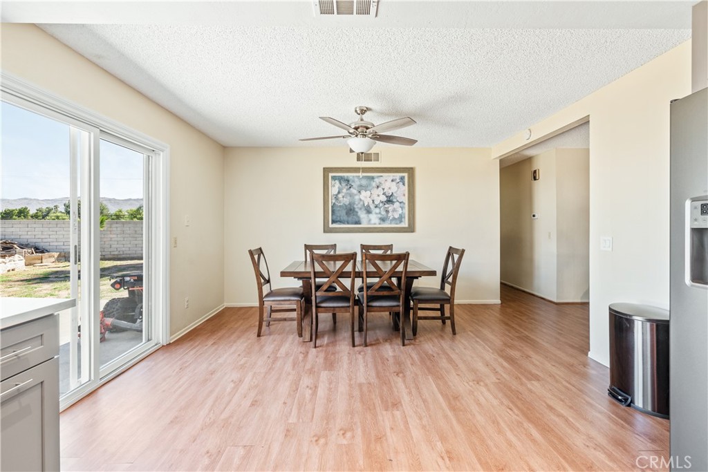 2111 Whitestone Drive Riverside, CA 92506 - Photo 7 of 17 a view of a dining room with furniture and wooden floor