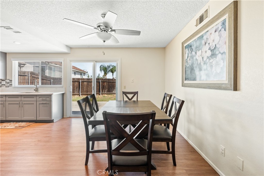 2111 Whitestone Drive Riverside, CA 92506 - Photo 8 of 17 a view of a dining room with furniture window and wooden floor