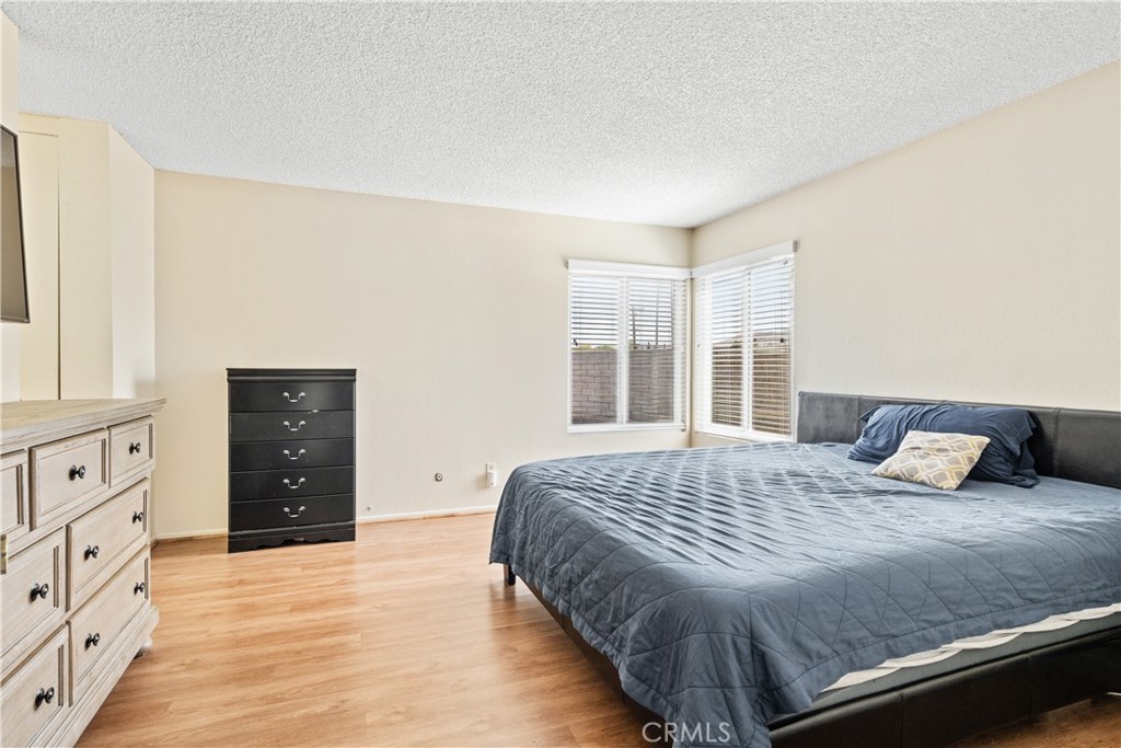 2111 Whitestone Drive Riverside, CA 92506 - Photo 9 of 17 a bedroom with a large bed and a dresser