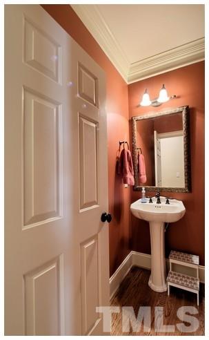 9709 Bailey Grove Court Raleigh, NC 27613 - Photo 22 of 25 a bathroom with a sink and mirror