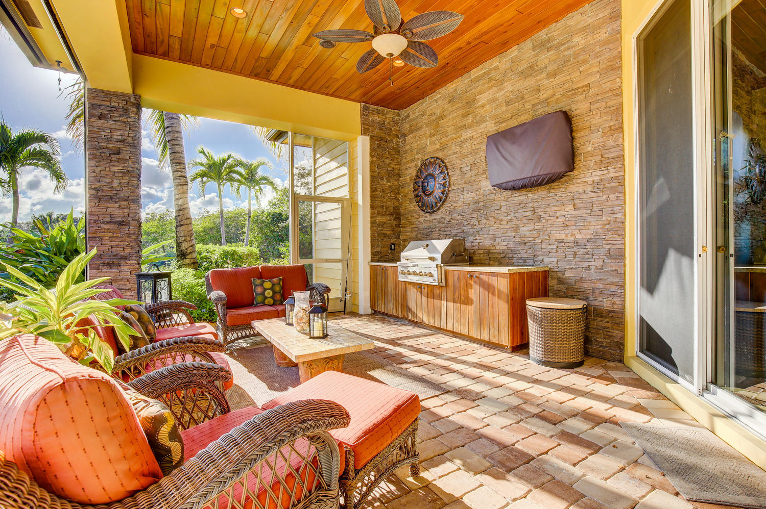 10410 Southeast Ridgeview Circle Tequesta, FL 33469 - Photo 14 of 27 Covered Patio with Retractable Screens