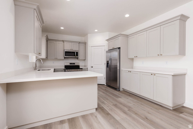 51 West 500 South Monroe, UT 84754 - Photo 13 of 41 Modern kitchen featuring light gray cabinetry, white countertops, stainless steel appliances, wood-finish flooring, and recessed lighting