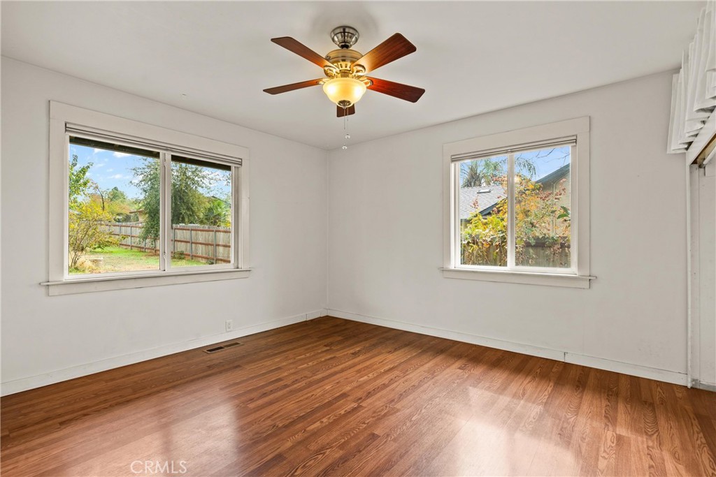 5416 Foster Road Paradise, CA 95969 - Photo 18 of 30 a view of an empty room with window and wooden floor