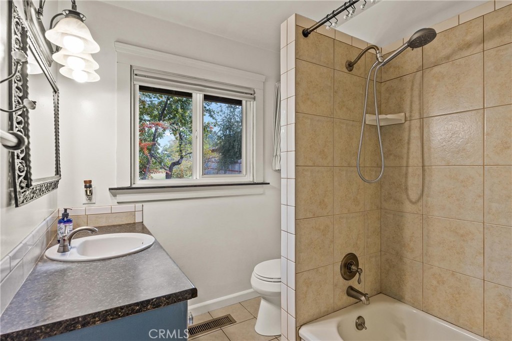 5416 Foster Road Paradise, CA 95969 - Photo 19 of 30 a bathroom with a sink toilet a mirror and shower